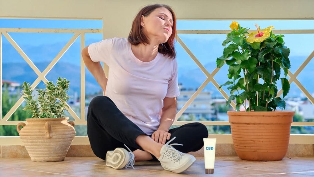 A woman using CBD for back pain
