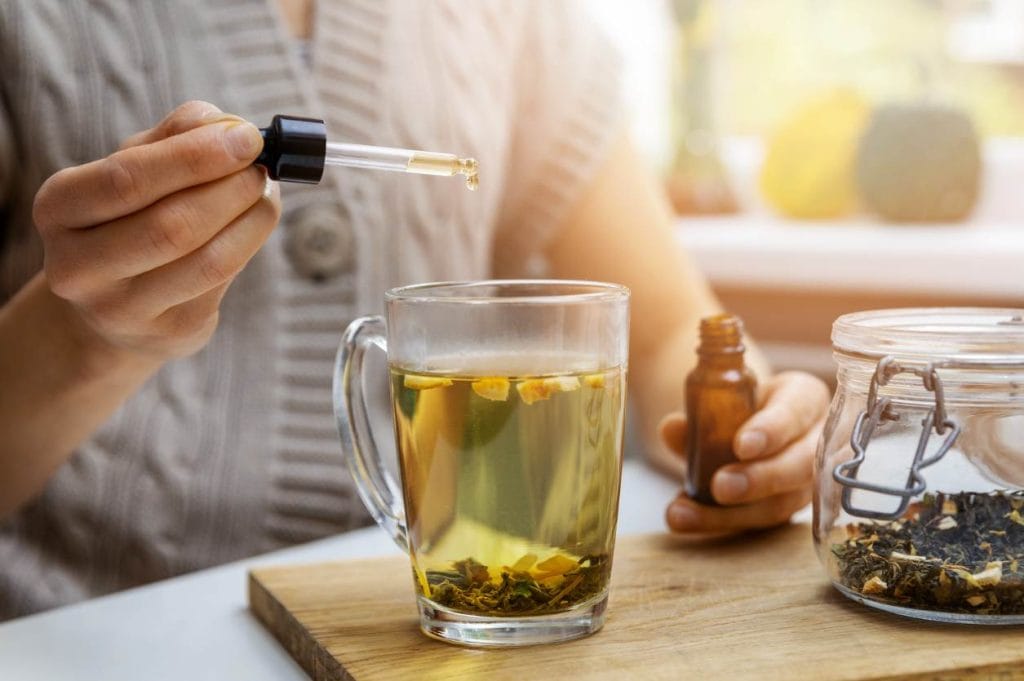Using CBD drops for pain by adding it to tea