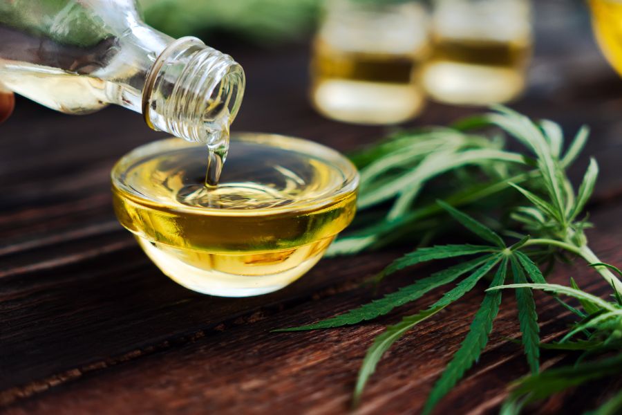 Pouring cannabis oil