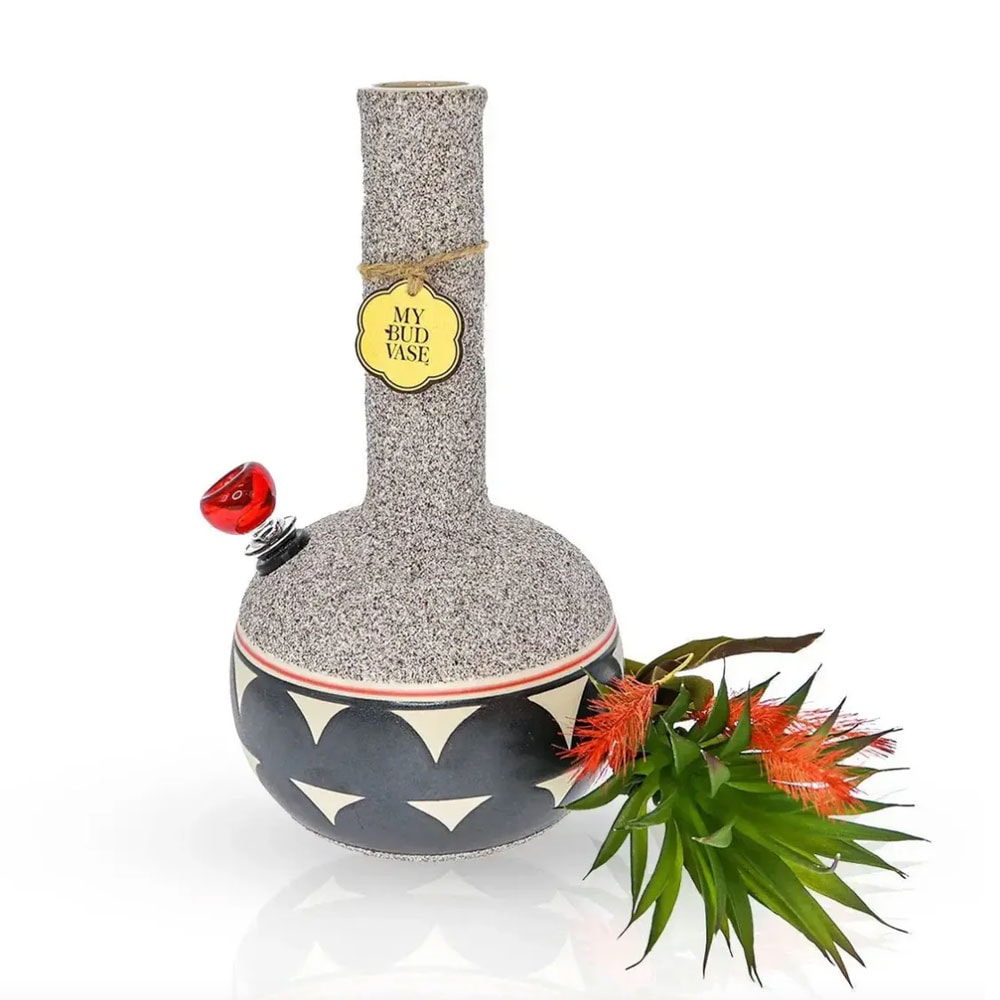 Coyōté Vase Bong by My Bud Vase, a textured ceramic-style water pipe with a natural, earthy finish and slim silhouette, styled as a decorative vase and positioned on a clean, modern tabletop.