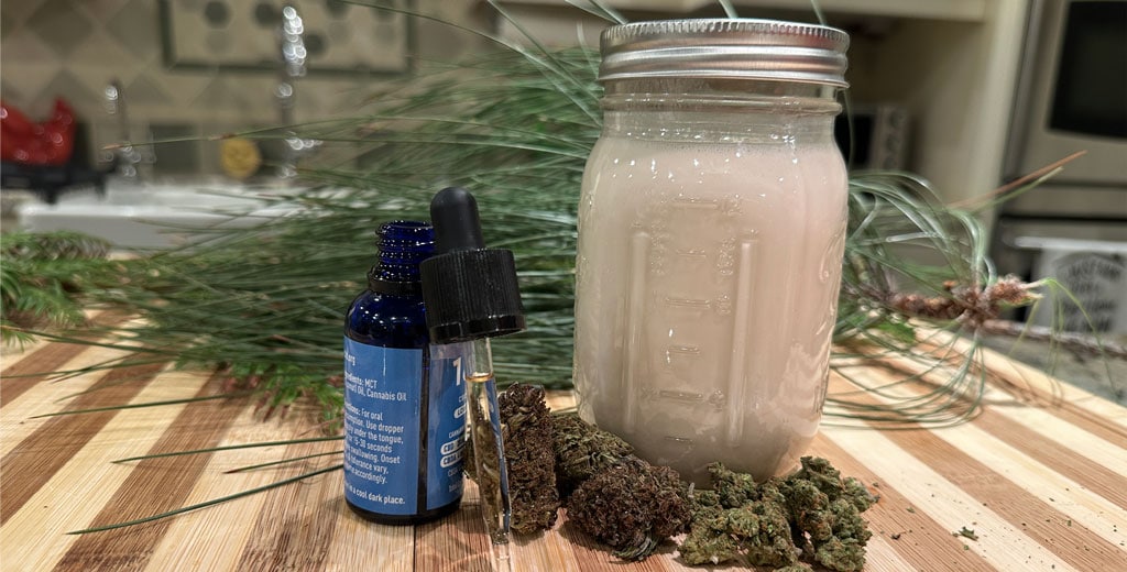 Cannabis infusion options including a jar of cannabis-infused milk, a THC or CBD tincture with dropper, and dried cannabis flower on a wooden board.