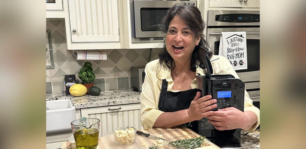 Maria using Levo II Infuser on her kitchen