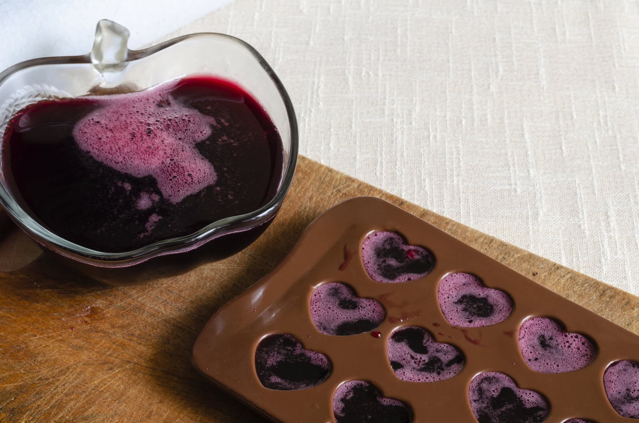 Silicone candy molds filled with homemade fruit gummies for making weed edibles at home
