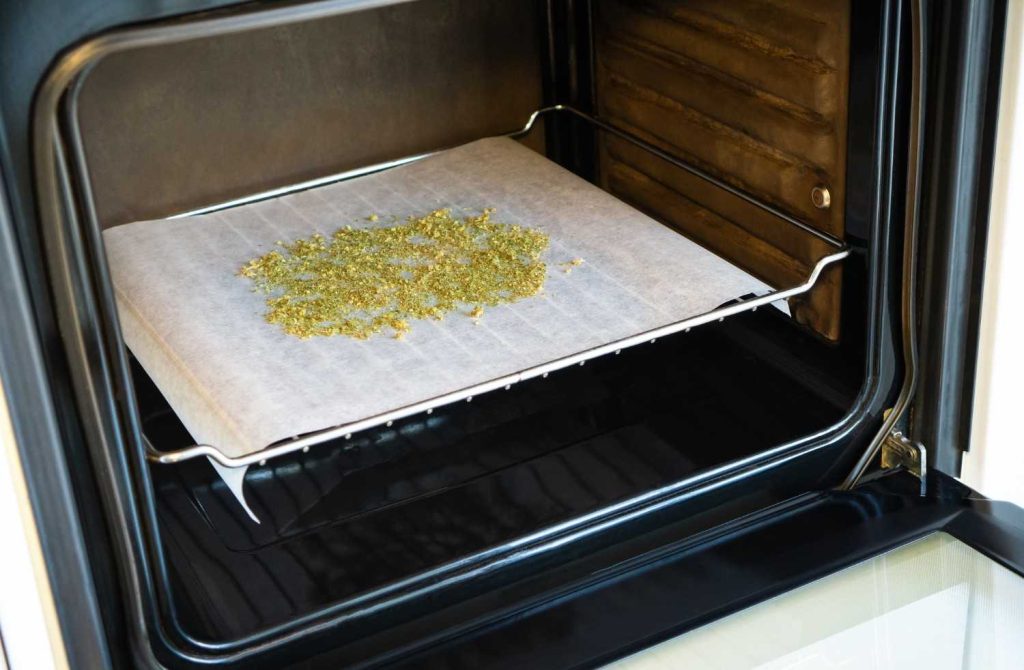 Kief on parchment paper, placed on the middle rack during decarboxylation at 240°F. 