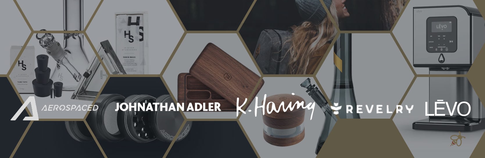 Curated selection of premium cannabis accessories, including grinders, rolling trays, glassware, and infusion devices, arranged in a modern lifestyle layout.